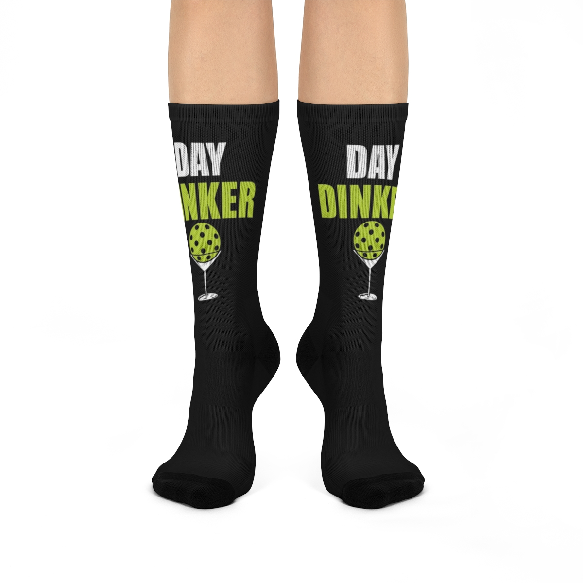 Best pickleball socks in the form of a black sock with the words day dinker on it. there is a pickleball in a margarita glass.